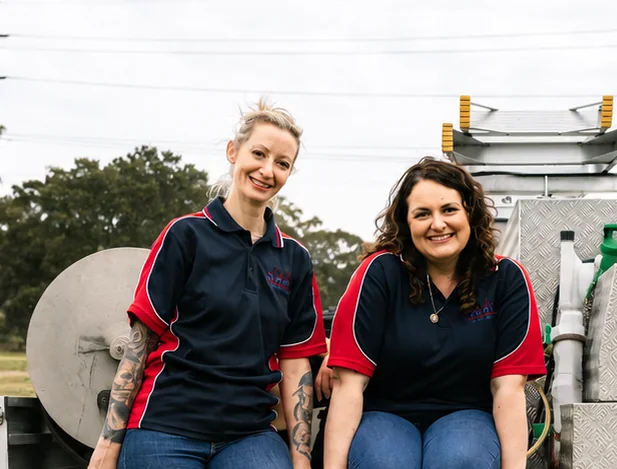 Two CPR Pest Management team members beside a service ute